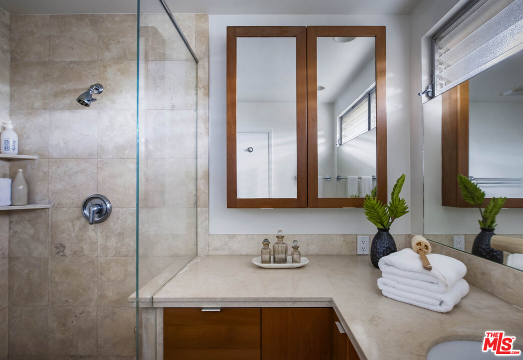 921 North San Marcos Road Santa Barbara, CA 93111 - Photo 27 of 44 a bathroom with sink and mirror