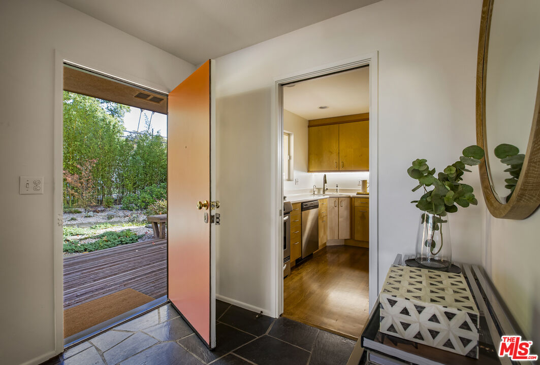 921 North San Marcos Road Santa Barbara, CA 93111 - Photo 10 of 44 a hallway with a potted plant and a window