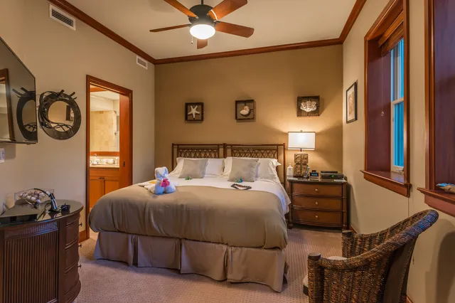 a bedroom with a bed and window