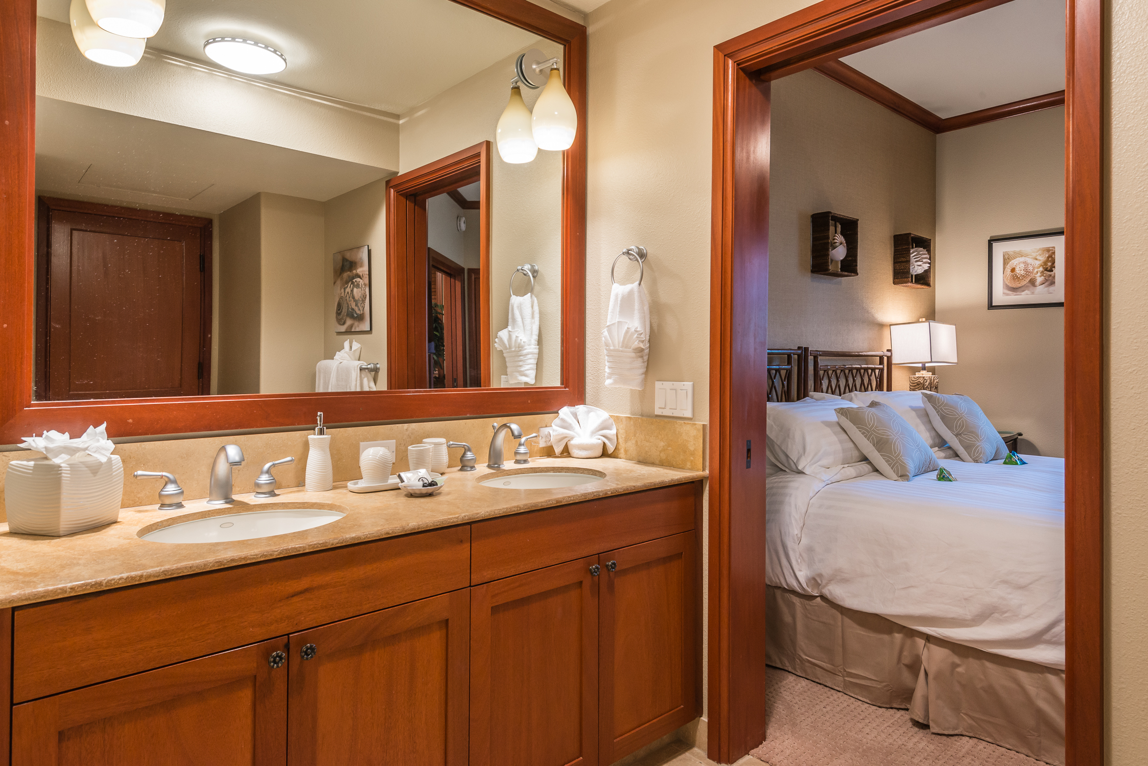 69-1000 Kolea Kai Circle, Unit 9E Waikoloa, HI 96738 - Photo 14 of 27 a en suite bathroom with a sink double vanity and a mirror
