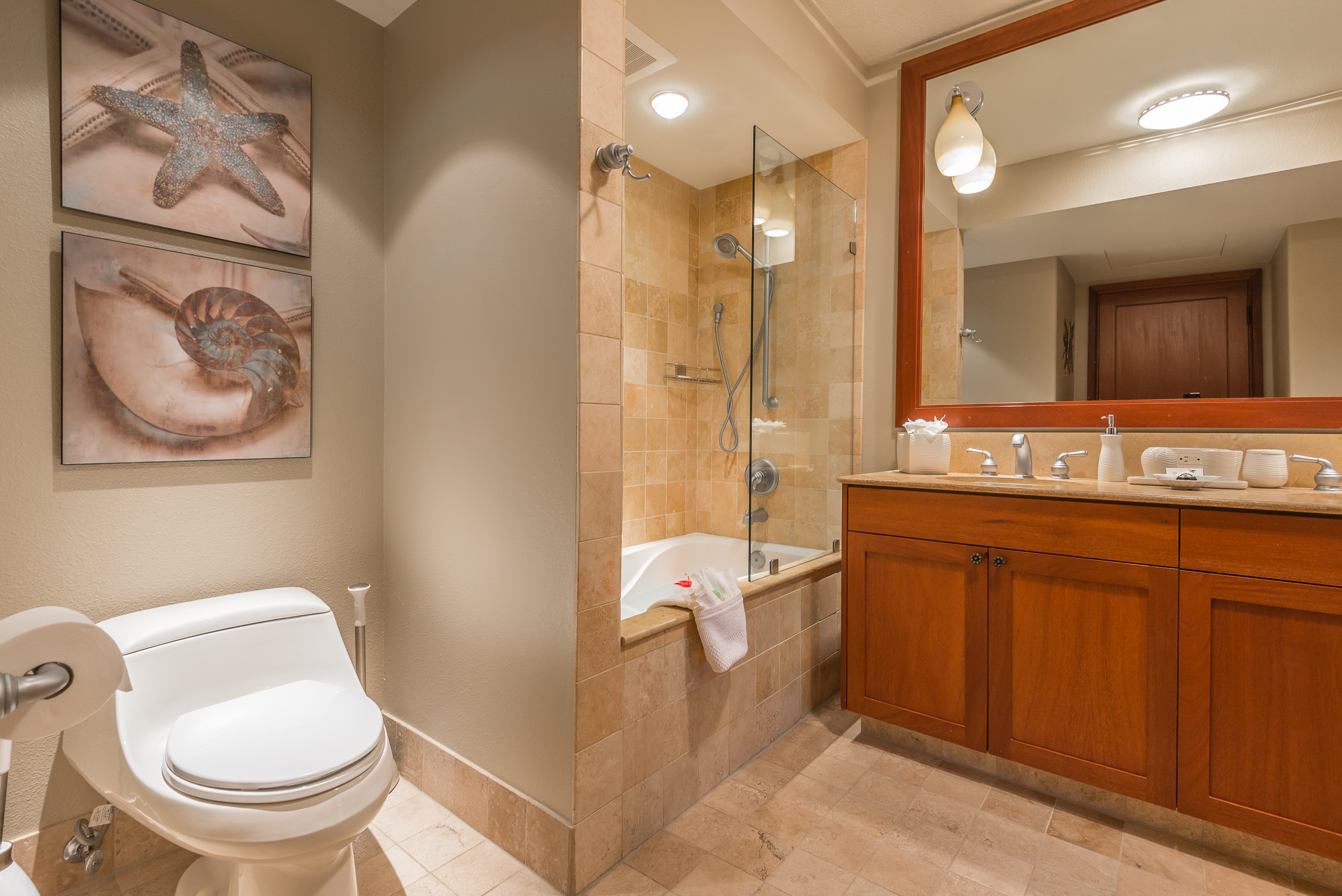69-1000 Kolea Kai Circle, Unit 9E Waikoloa, HI 96738 - Photo 15 of 27 a bathroom with a granite countertop sink toilet and shower