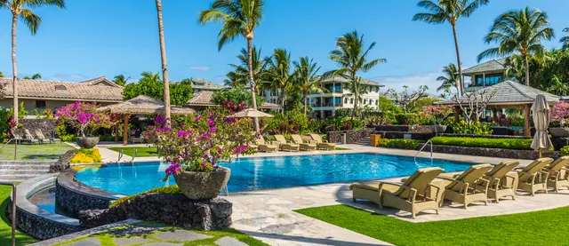 a view of a swimming pool with a patio