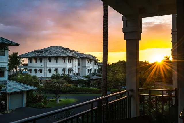 a view of a house next to a yard