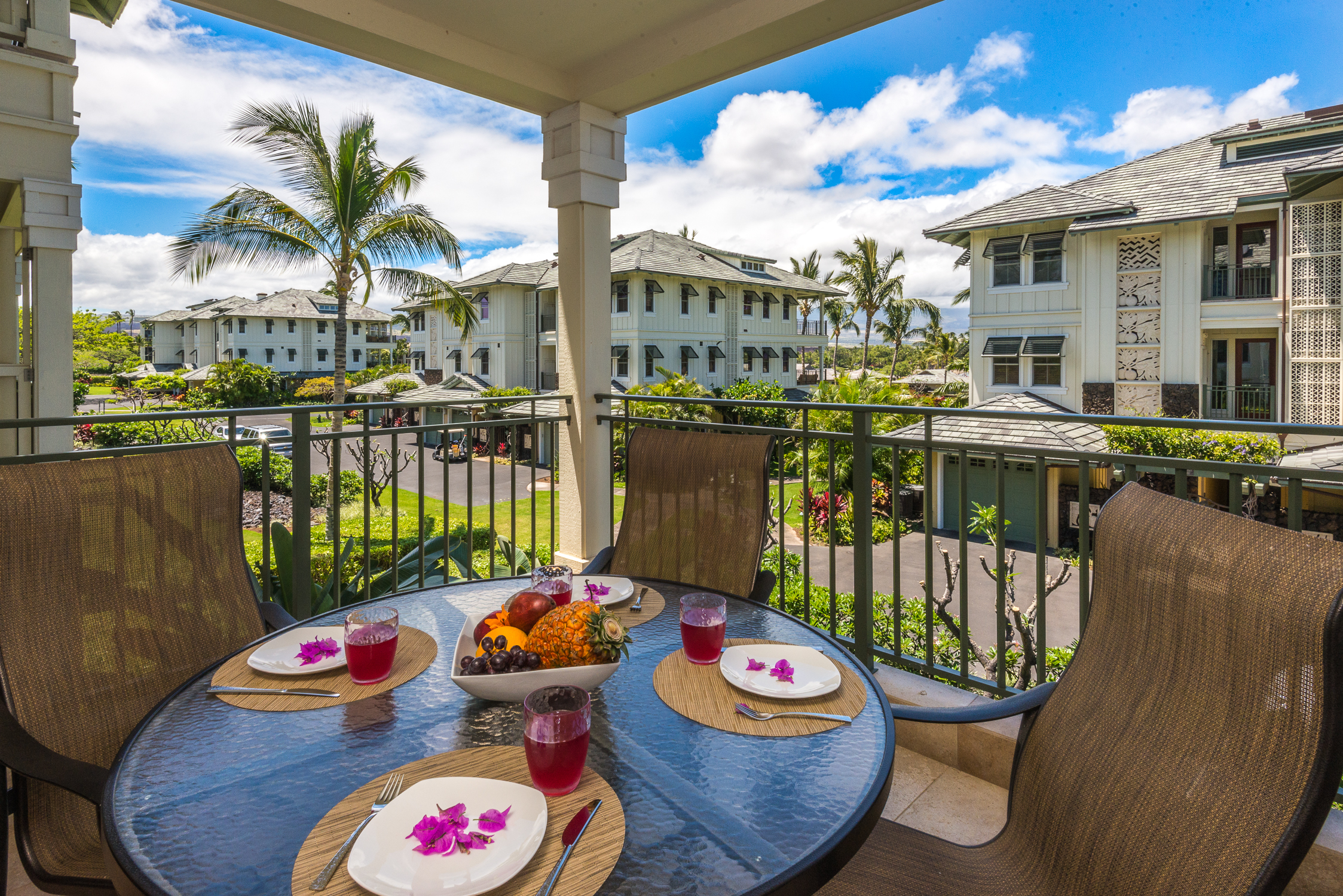 69-1000 Kolea Kai Circle, Unit 9E Waikoloa, HI 96738 - Photo 7 of 27 a table and chairs in a patio