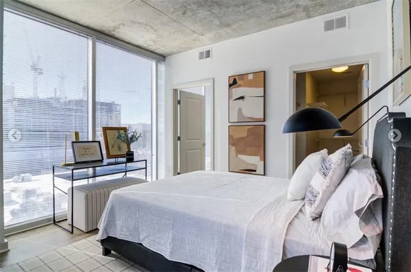 a bedroom with a bed and walk in closet