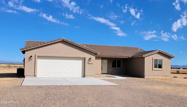 a front view of a house with a garage