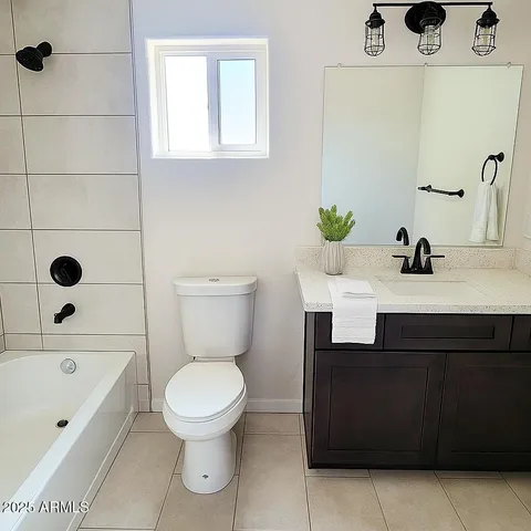 a bathroom with a sink a toilet and a bathtub