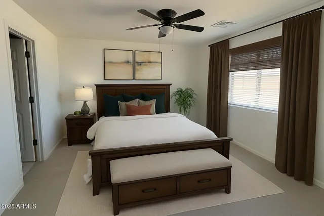 a bed room with a bed and a window