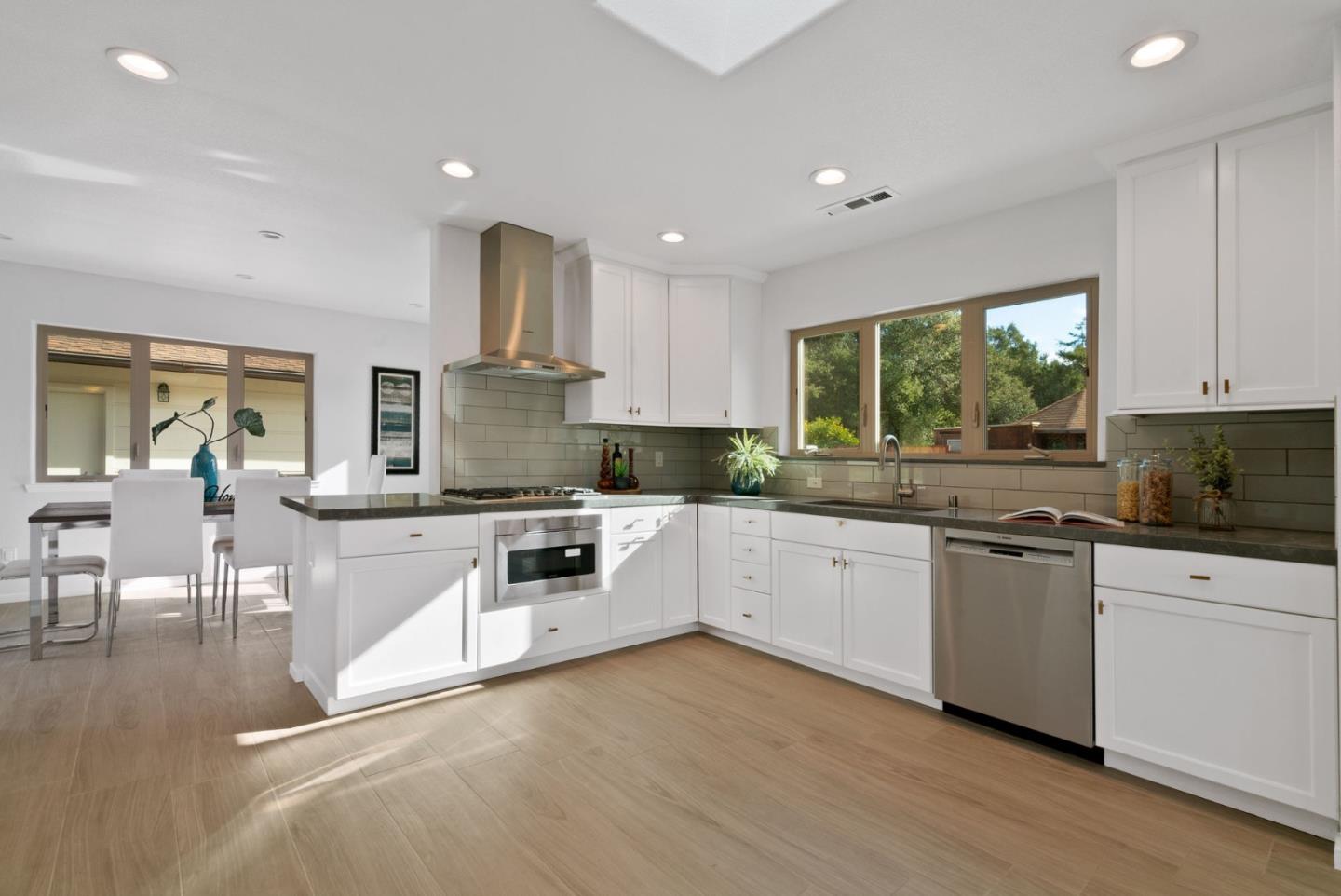 350 Sims Road Santa Cruz, CA 95060 - Photo 11 of 40 a kitchen with granite countertop white cabinets and white appliances