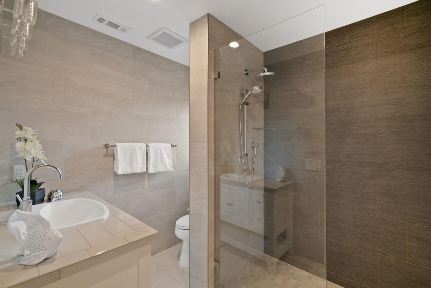 350 Sims Road Santa Cruz, CA 95060 - Photo 16 of 40 a bathroom with a granite countertop shower sink and vanity