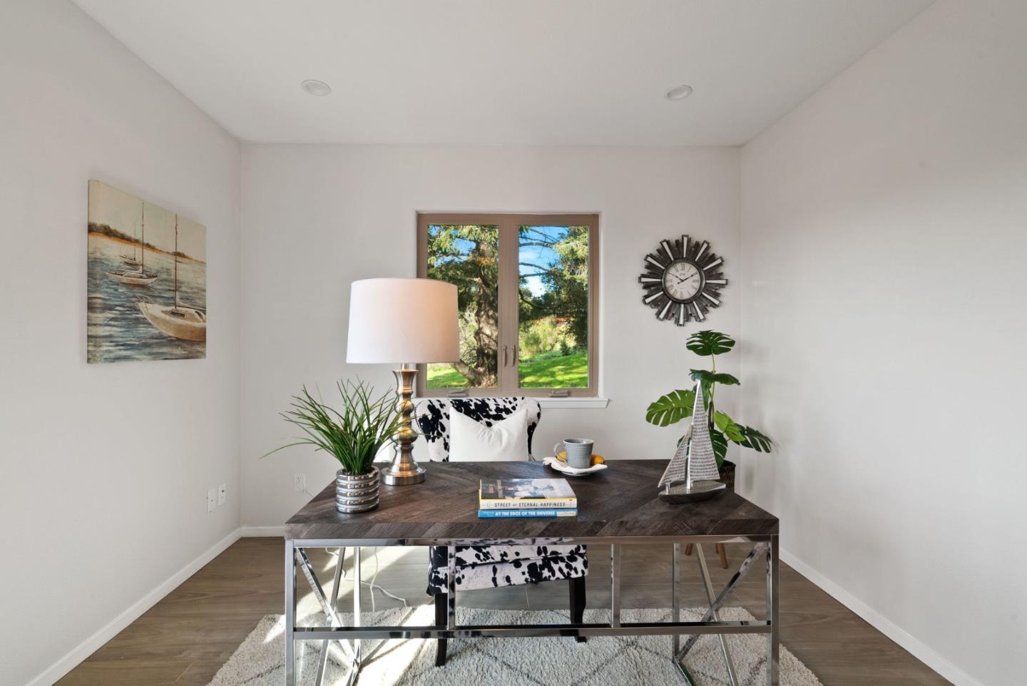 350 Sims Road Santa Cruz, CA 95060 - Photo 19 of 40 a dining room with furniture potted plants and wooden floor