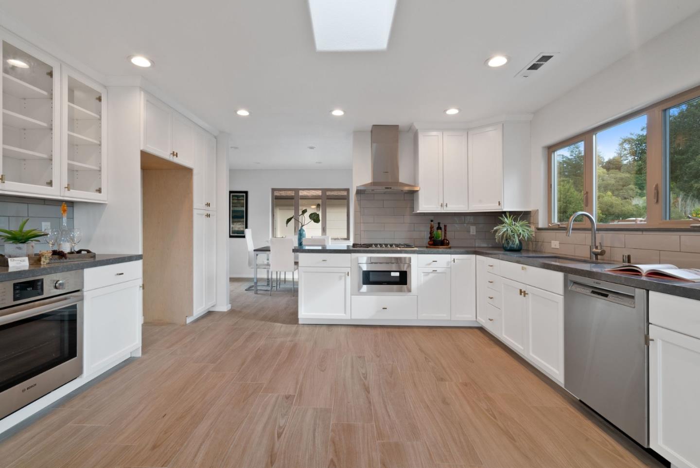 350 Sims Road Santa Cruz, CA 95060 - Photo 3 of 40 a large kitchen with stainless steel appliances granite countertop a lot of counter space and wooden floors