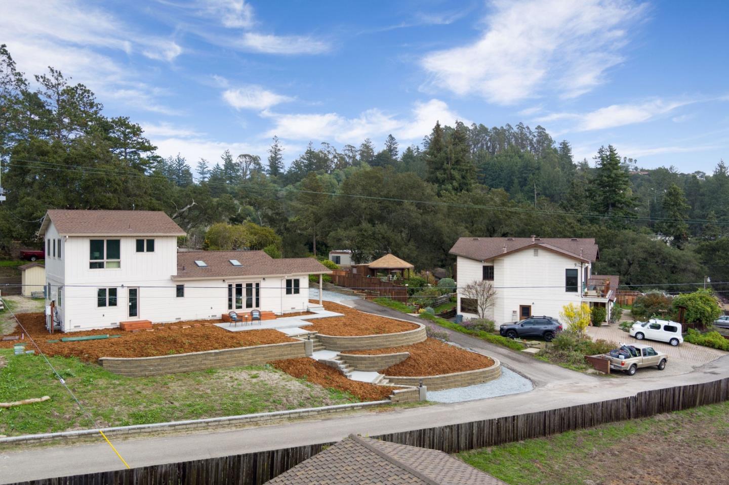 350 Sims Road Santa Cruz, CA 95060 - Photo 34 of 40 a view of a white house in front of a big yard with plants and large tree