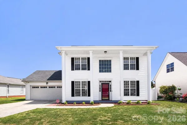 a front view of a house with an empty space