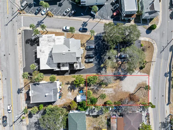 an aerial view of a house with a swimming pool