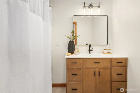 a bathroom with a sink and a mirror