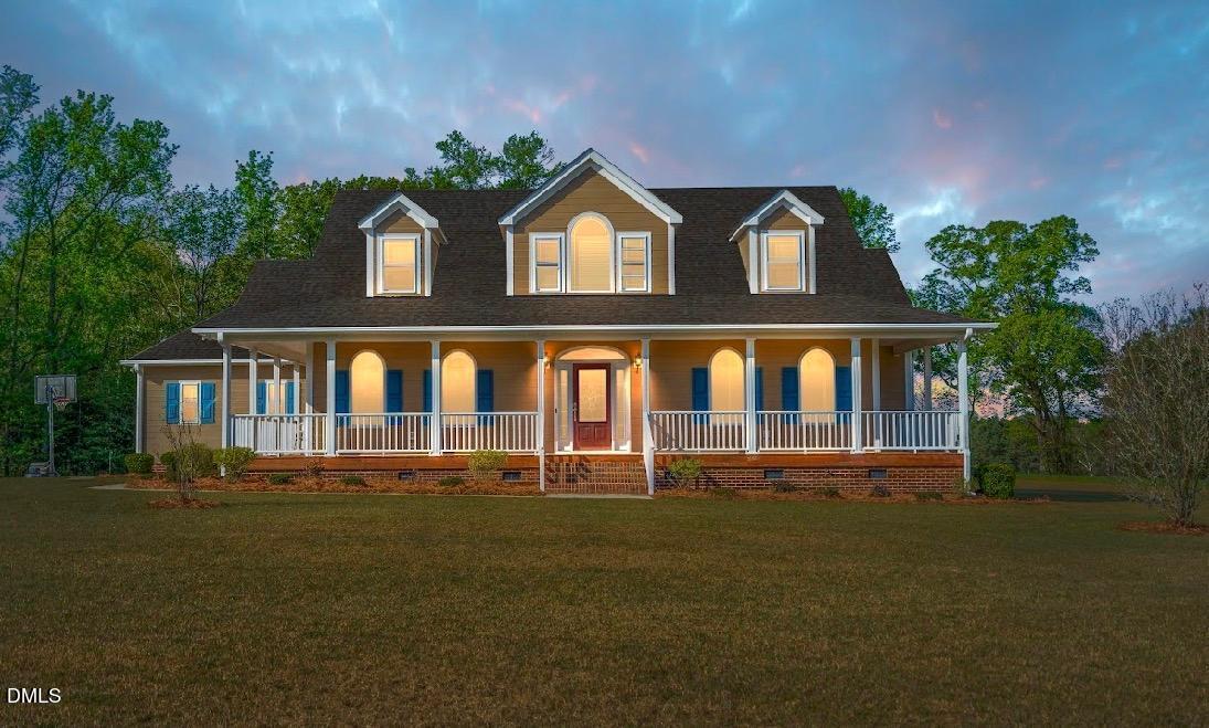 5780 McArthur Road Broadway, NC 27505 - Photo 1 of 40 a front view of a house with a yard
