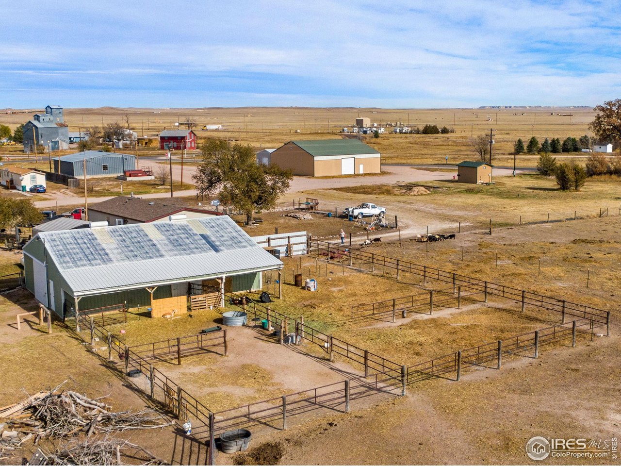 222 Kearney Street Grover, CO 80729 - Photo 2 of 50 36'x48' Barn also has wide door under 10' deep overhang and 4 pens with central watering tank.