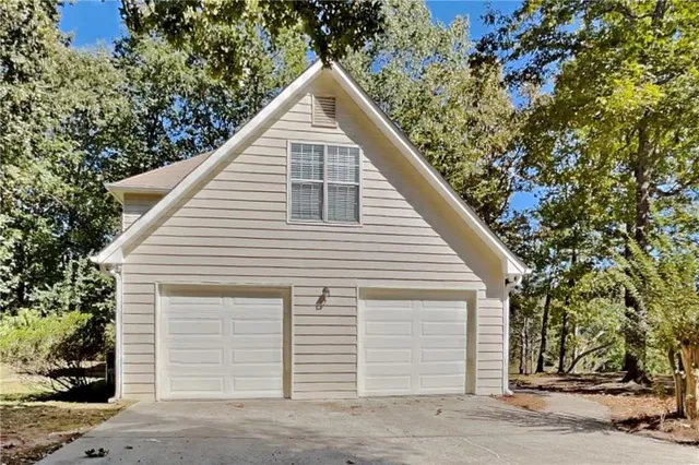 a view of a house with a tree