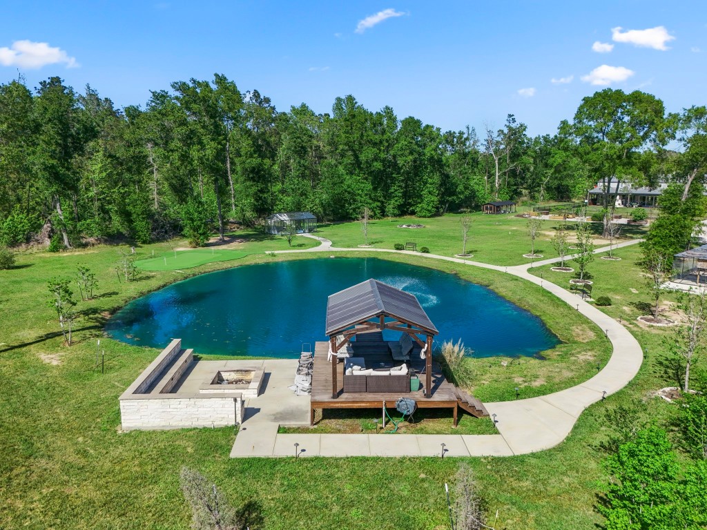 14972 Quinette Road Conroe, TX 77302 - Photo 43 of 50 Pond with dock, seating area and dock