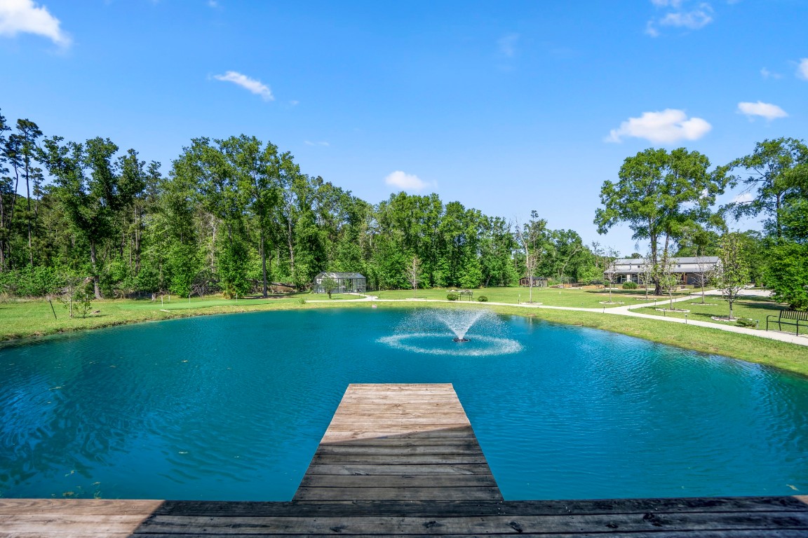14972 Quinette Road Conroe, TX 77302 - Photo 44 of 50 Pond with dock, seating area and dock