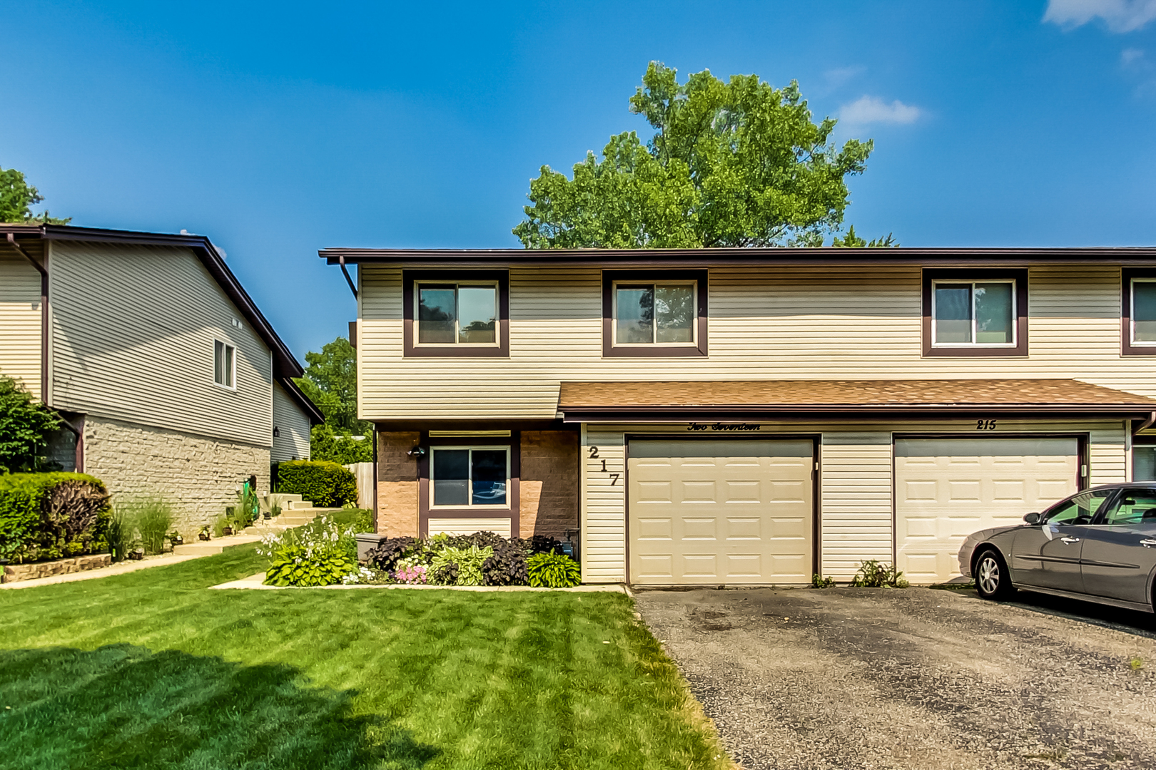 217 Troy Lane Lombard, IL 60148 - Photo 2 of 30 a view of a house with a garden