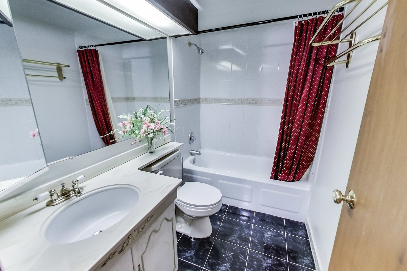 217 Troy Lane Lombard, IL 60148 - Photo 17 of 30 a bathroom with a sink a toilet and a mirror