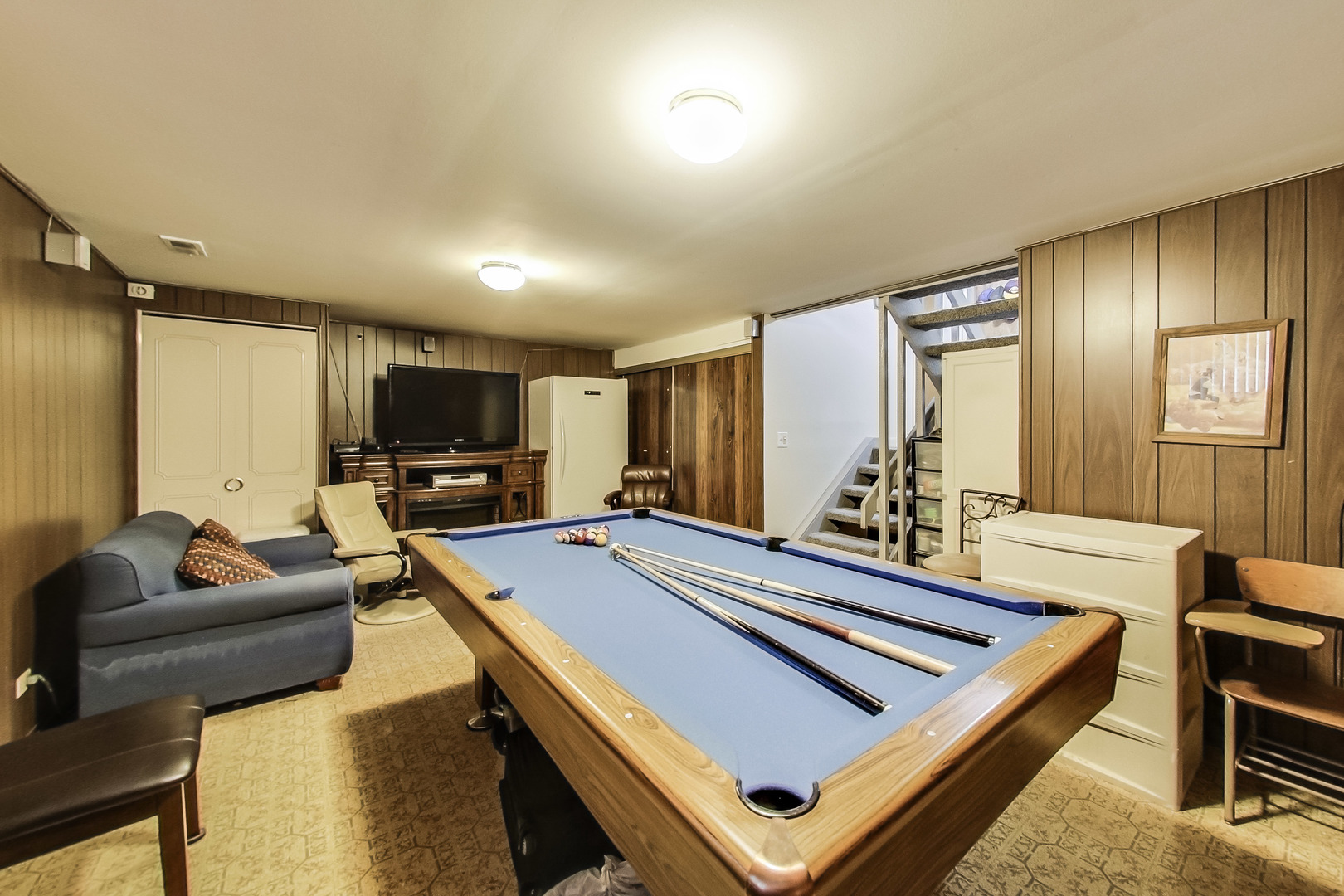 217 Troy Lane Lombard, IL 60148 - Photo 20 of 30 a room with furniture pool table flat screen tv and windows