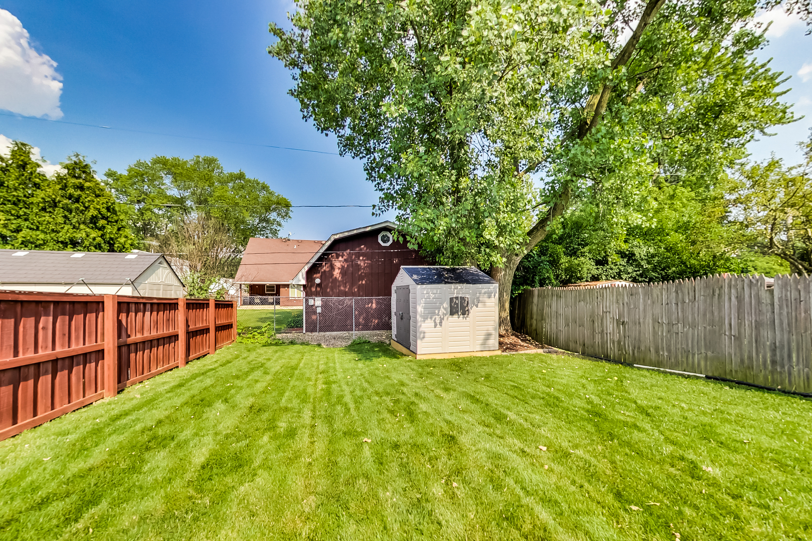 217 Troy Lane Lombard, IL 60148 - Photo 26 of 30 a view of a house with a yard and sitting area