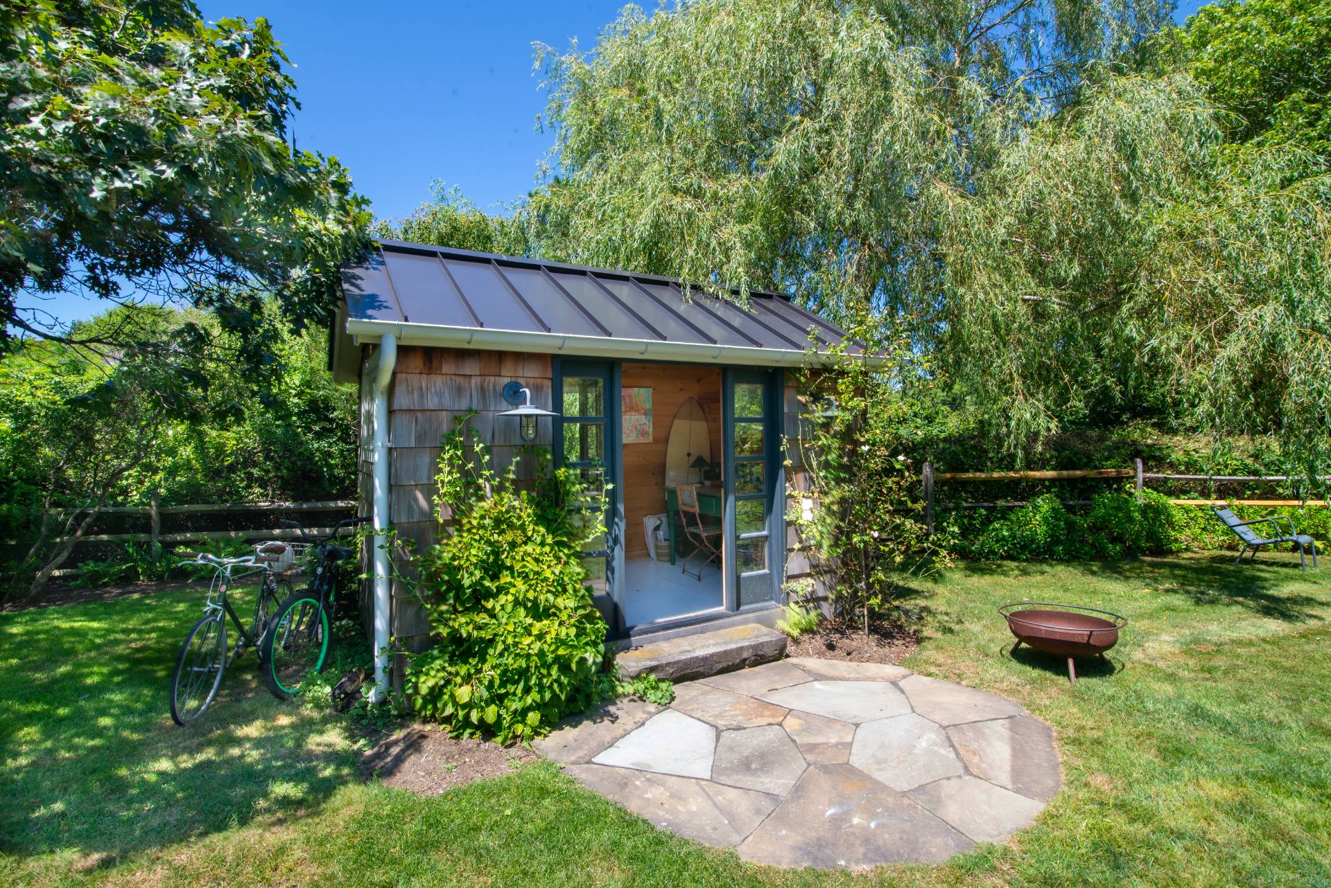 12 Jackson Road Montauk, NY 11954 - Photo 25 of 36 a front view of a house with garden