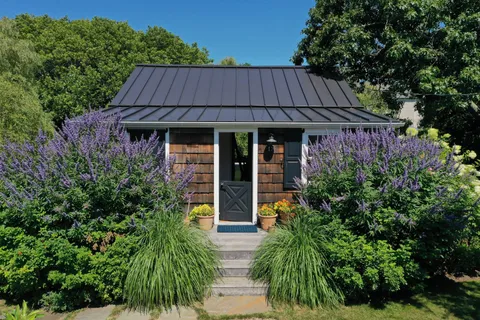 an aerial view of a house with a garden