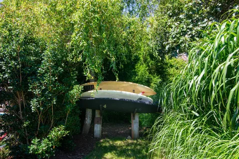 an aerial view of residential houses with outdoor space and street view