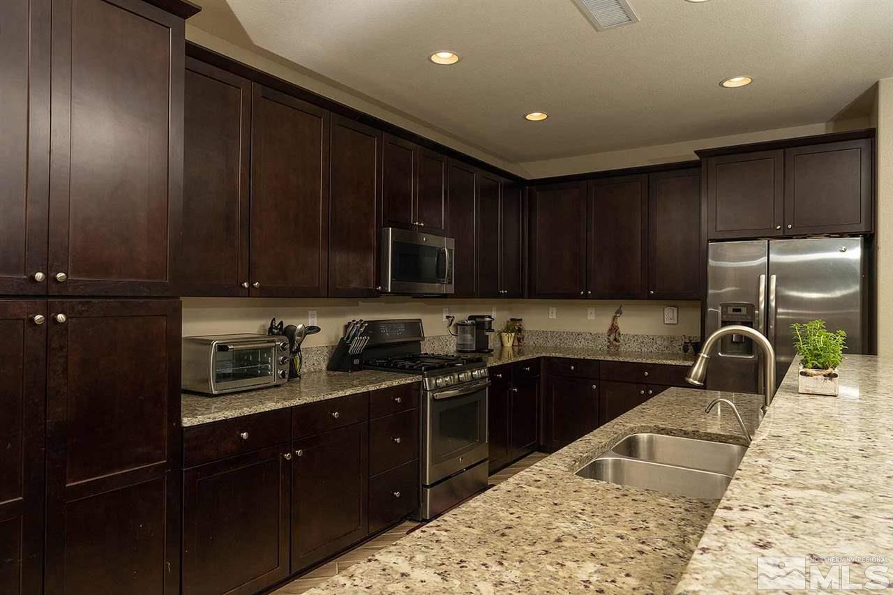 10741 Ridgebrook Drive Reno, NV 89521 - Photo 8 of 25 a kitchen with sink cabinets and window