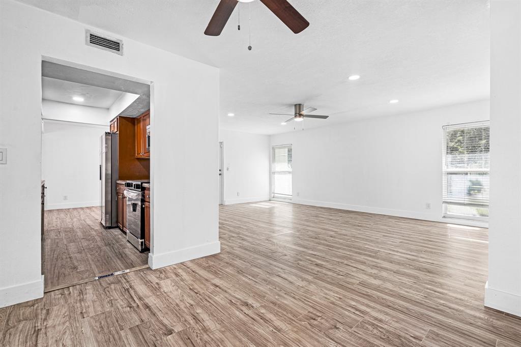 7007 Northwest 64th Street Tamarac, FL 33321 - Photo 12 of 41 a view of empty room with wooden floor