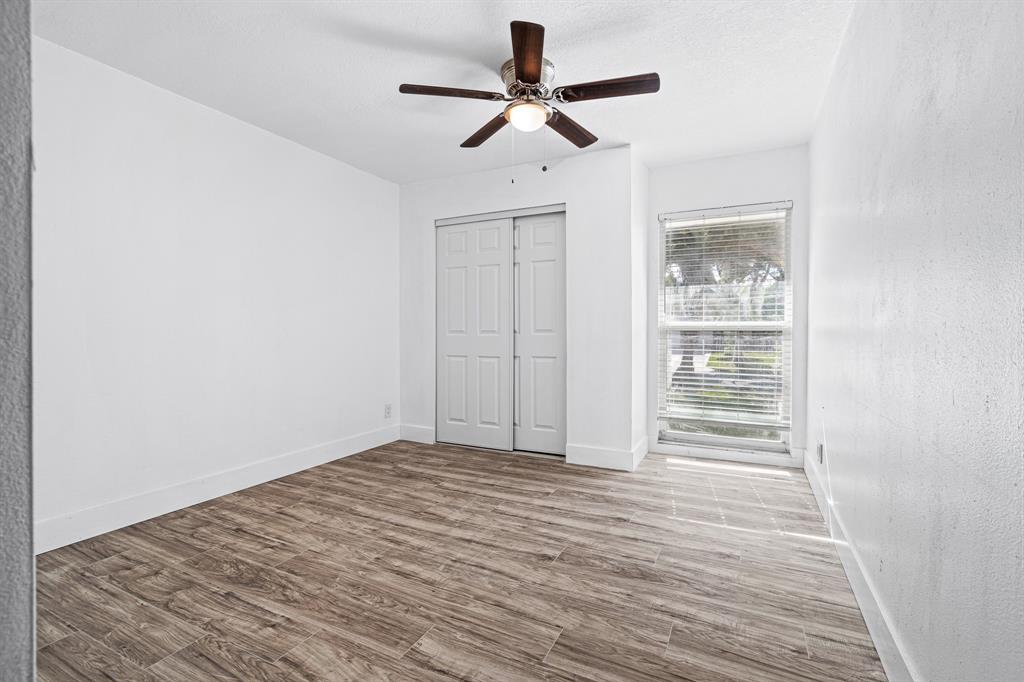 7007 Northwest 64th Street Tamarac, FL 33321 - Photo 19 of 41 a view of empty room with wooden floor