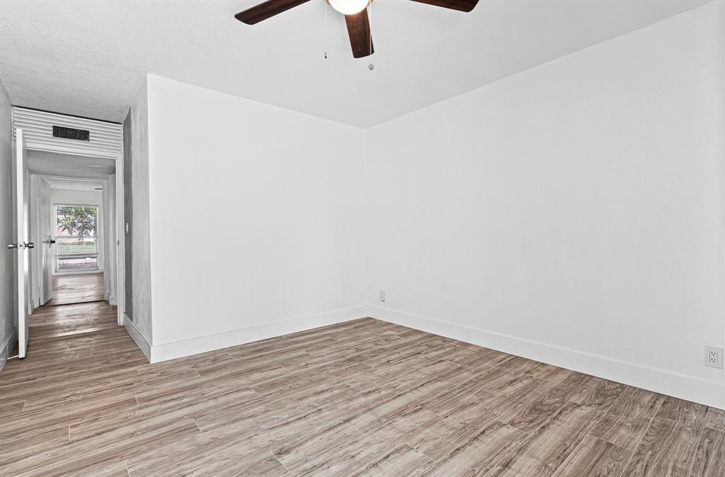 7007 Northwest 64th Street Tamarac, FL 33321 - Photo 20 of 41 wooden floor in an empty room