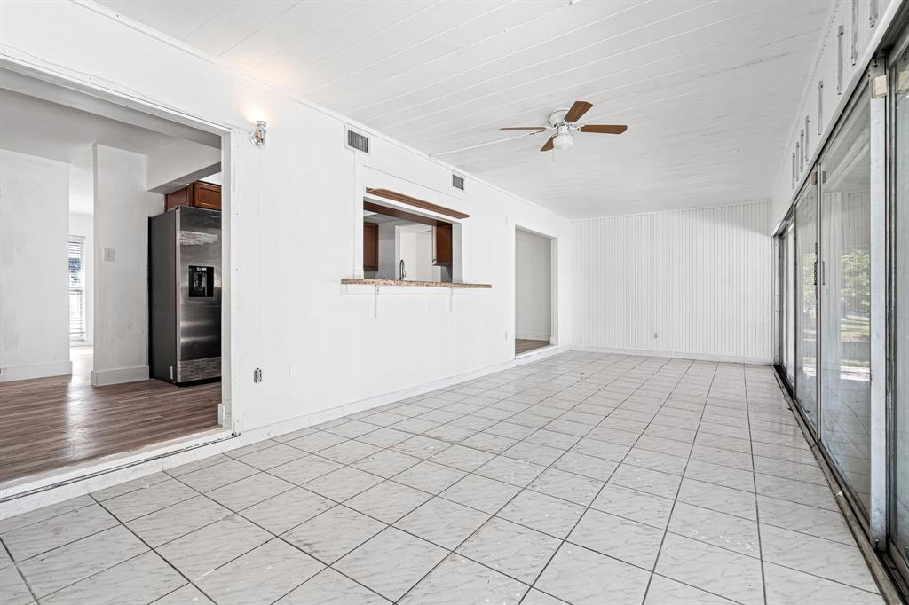 7007 Northwest 64th Street Tamarac, FL 33321 - Photo 28 of 41 a view of a hallway with wooden floor and staircase