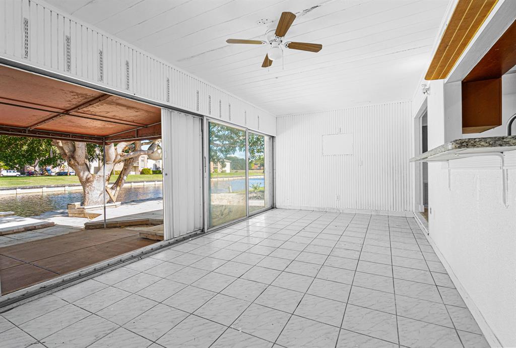 7007 Northwest 64th Street Tamarac, FL 33321 - Photo 41 of 41 a view of empty room with wooden floor and fan