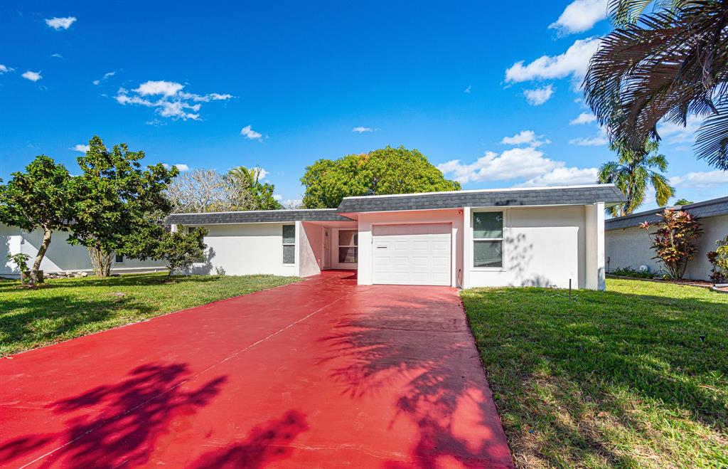 7007 Northwest 64th Street Tamarac, FL 33321 - Photo 6 of 41 a view of a house with backyard and garden