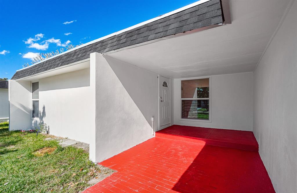 7007 Northwest 64th Street Tamarac, FL 33321 - Photo 7 of 41 a backyard of a house