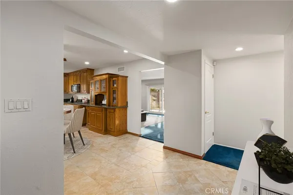 a living room with furniture rug and wooden floor