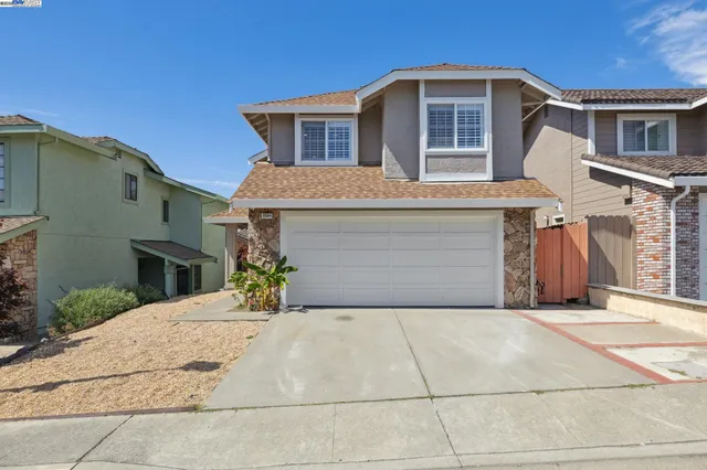 a front view of a house with yard