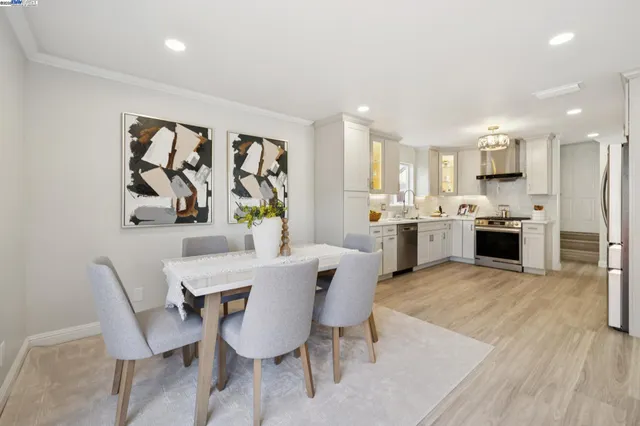 a view of kitchen with cabinets and stainless steel appliances