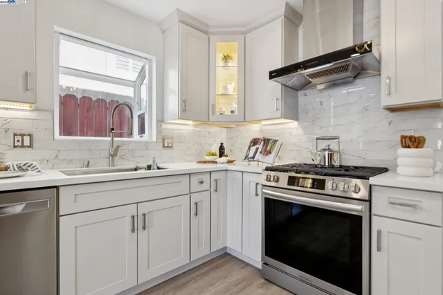 a kitchen with a stove oven and sink
