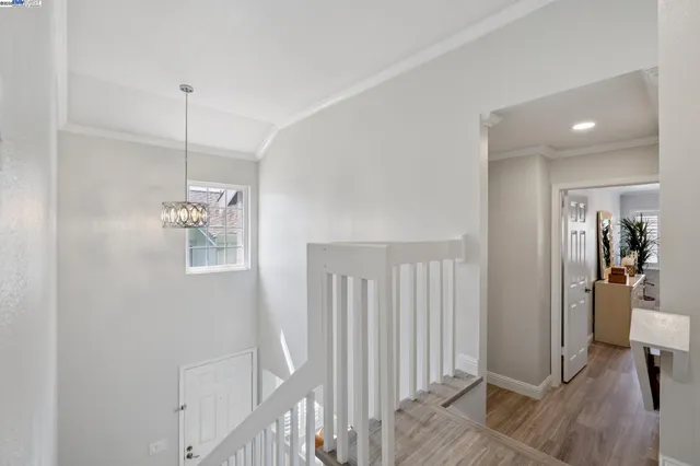 a bedroom with a bed and a night stand