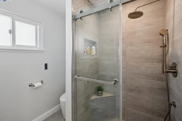 a bedroom with a bed and a table