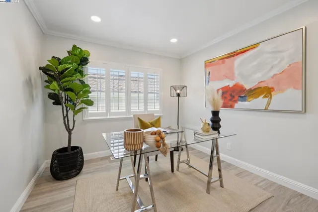 a bathroom with double vanity a sink a mirror a window and vanity