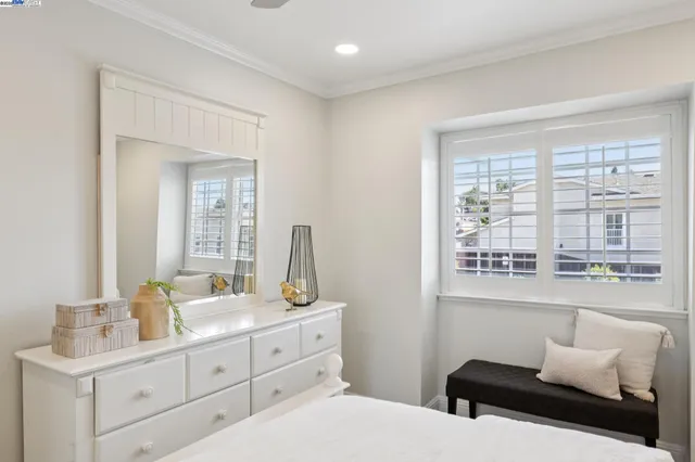 a bedroom with a bed and a night stand