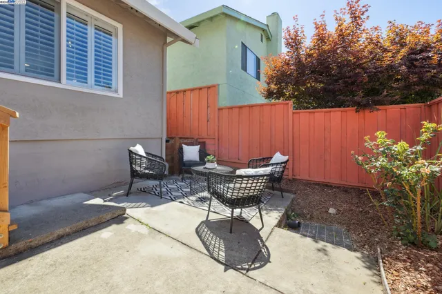 a view of a chairs and table in the patio