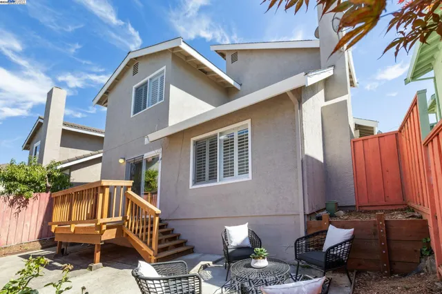 an aerial view of a house with a garden and balcony